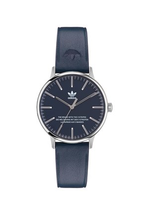 Montre pour homme avec un boîtier rond en acier inoxydable argenté, un bracelet en cuir bleu marine, un cadran minimaliste, des index heures argentés et le logo Adidas.
