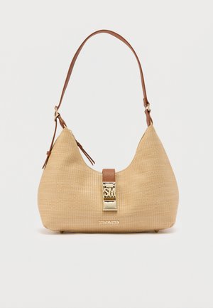 Beige woven shoulder bag with brown leather strap, gold-tone clasp embroidered with "SM," and "Steve Madden" logo on front.
