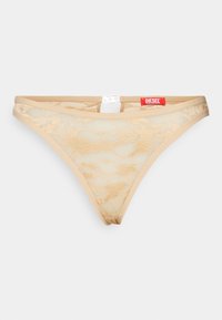 Beige spets-trosa med en genomskinlig textur, med en liten utskärning på baksidan och en röd Diesel-logotags på midjebandet.