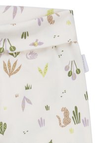 Legginsy bawełniane o jasnocremowym tle. Zawierają powtarzający się wzór roślin oraz cętkowanego kota w ziemistych odcieniach i pastelach.