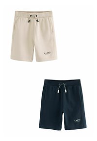 Pantalones cortos de sudadera en color beige y marino, hechos de un tejido suave; cinturilla elástica con cordones, bolsillos laterales y detalle del logo en el dobladillo.