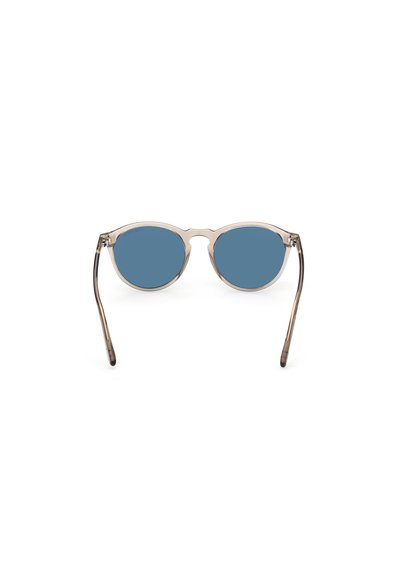 Sonnenbrille mit runden blauen Gläsern, transparentem Rahmen und schlanken Metallbügeln, ausgestattet mit einer subtilen Verlaufstextur.