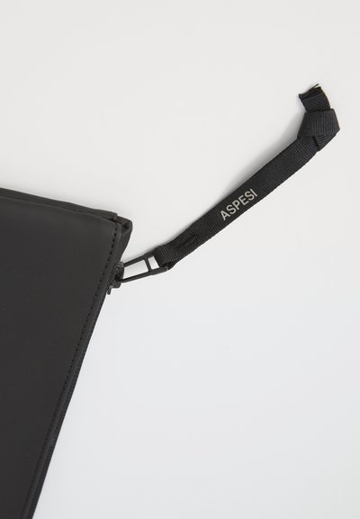 Black zippered pouch made of smooth material, featuring a branding tag with "ASPESI" on a webbing strap. Minimalist design with clean lines.