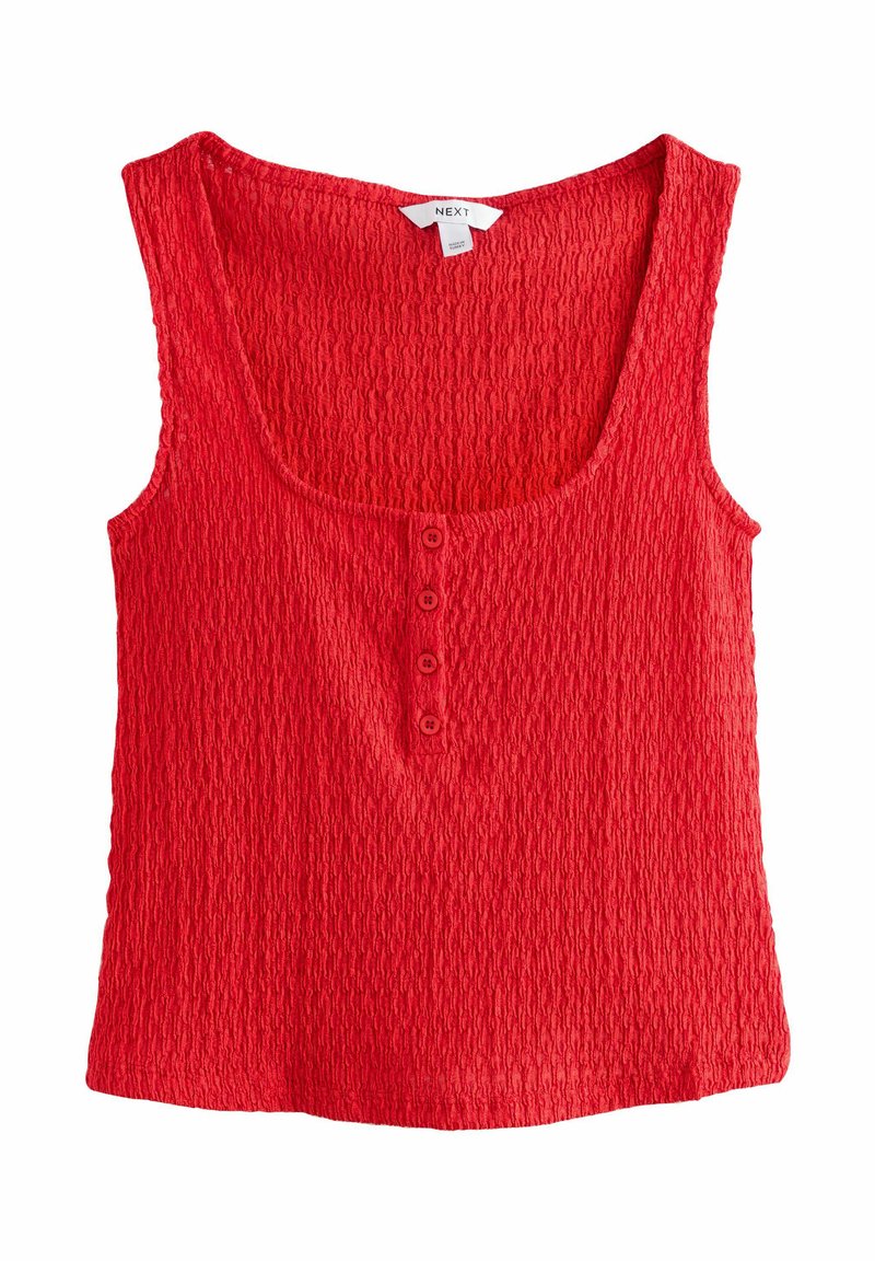 Canottiera rossa texturizzata con scollatura a barca e patta con quattro bottoni sul davanti. Realizzata in materiale leggero con una superficie irregolare.