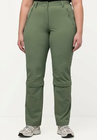 Pantaloni leggeri da outdoor verdi con gamba dritta, tasche anteriori con zip e orlo regolabile. Realizzati in materiale sintetico per garantire durata.