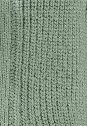 Tejido de punto en color verde claro y suave con un patrón acanalado texturizado. El material parece acogedor, con detalles visibles de hilo y puntos uniformes.