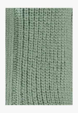 Gebreide stof in een zachte, lichtgroene kleur met een gestructureerd ribbelpatroon. Materiaal oogt gezellig, met zichtbare garendetails en gelijkmatige steken.