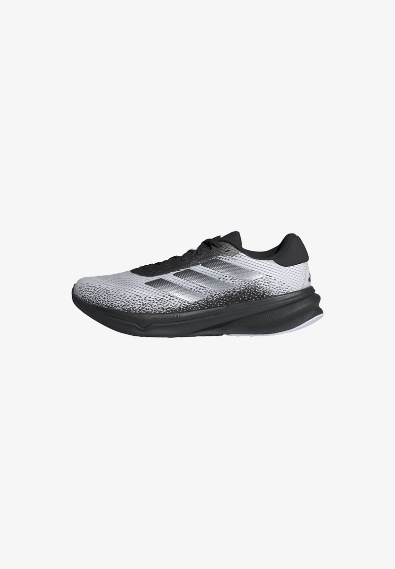 Black and white running shoe featuring a textured mesh upper, contrasting sole, and three side stripes. Lightweight with a rounded toe design.