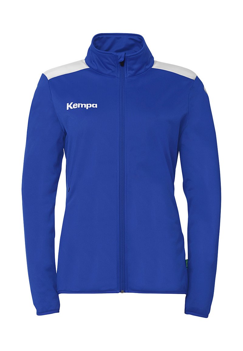 Blå atletisk jakke med høj krave, fuld lynlås, hvide skulderdetaljer og et logo på brystet. Fremstillet af glat, strækbart stof.