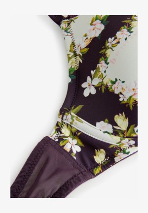 Sostén de bikini floral con una base de color púrpura oscuro y patrones florales claros. Tejido suave con costuras elásticas y tirantes ajustables.