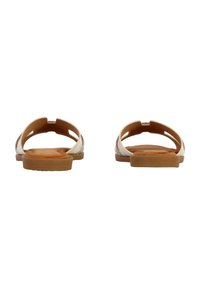 Sandali bianchi open-toe con suole in gomma tan durevoli. Presentano un design a tagli, una soletta imbottita e decorazioni laterali. 