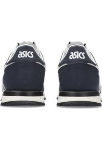 Navy blue suede and mesh sneakers with white accents, featuring a black rubber sole and prominent ASICS branding on the heel.