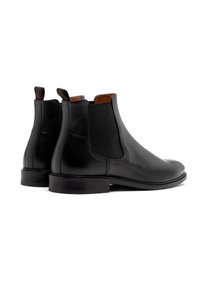 Czarne skórzane buty Chelsea z elastycznymi bocznymi panelami, okrągłym noskiem i niskim obcasem. Wnętrze wyłożone brązową podszewką.