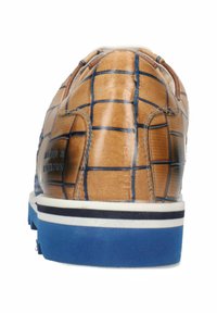 Brown leather sneaker with a grid pattern, blue accents, and a white rubber sole. Features a rounded toe and stitched details.