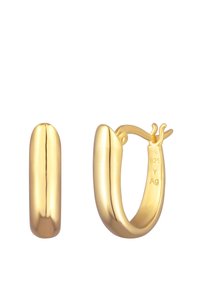Boucles d'oreilles créoles en ton doré avec un design lisse et arrondi. Dotées d'un fermoir à clic et estampillées 925 pour indiquer leur teneur en argent sterling.