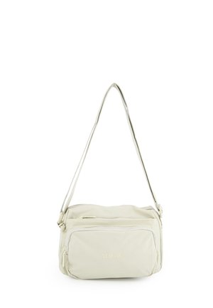 Lille beige crossbodytaske med en lynlåslomme foran og justerbar skulderrem, mærket "Venezia" på fronten.