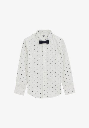 Bijela košulja dugih rukava s mornarskim uzorkom sidra i odgovarajućom leptir mašnom. Ima ovratnik s kopčanjem na gumbe i ravan rub.