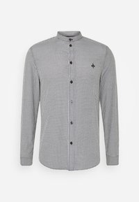 Camisa de cuadros en blanco y negro de manga larga con cuello mao, que presenta botones negros y un pequeño logotipo en el pecho.