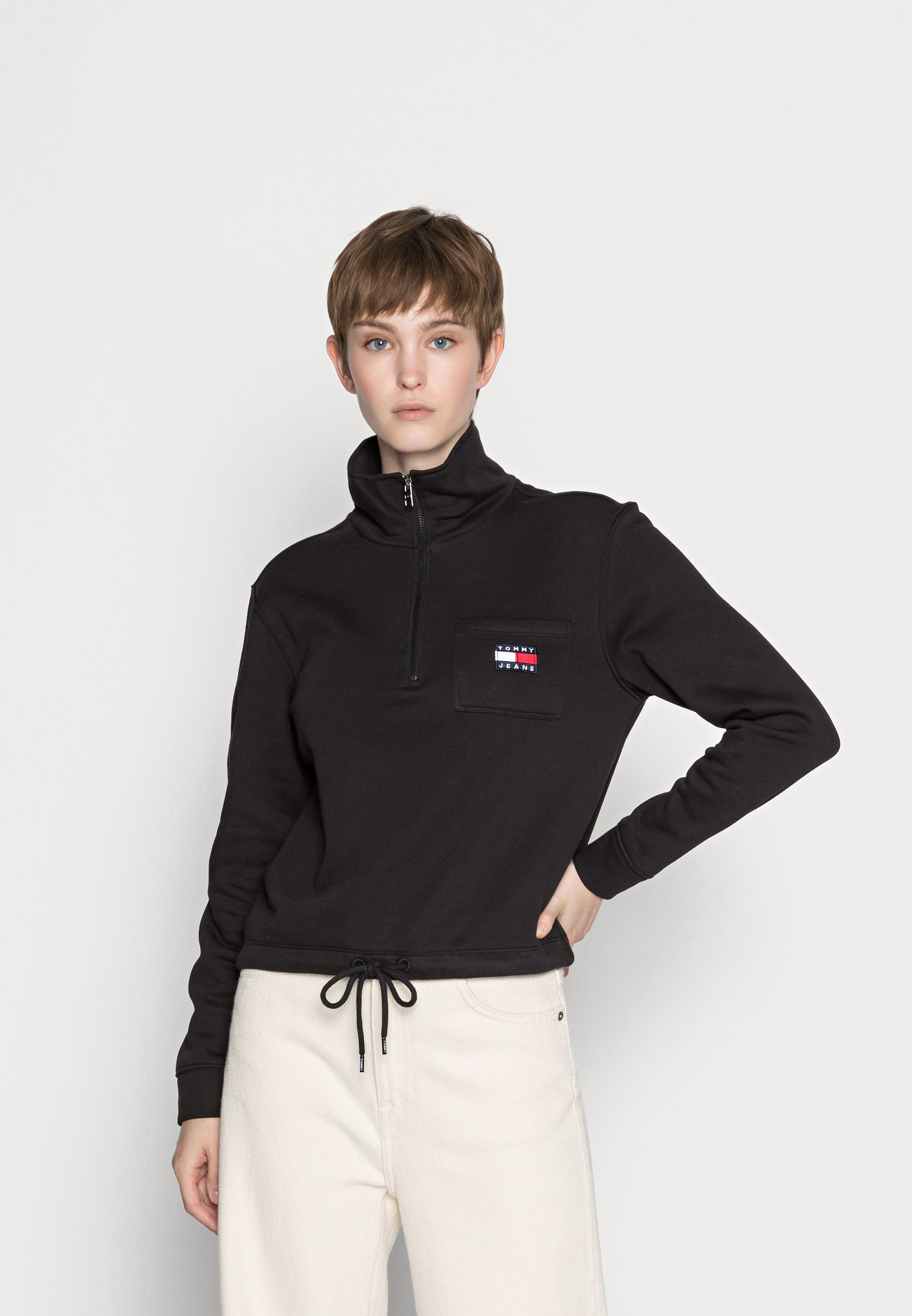 tommy badge zip