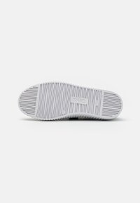 White rubber shoe sole with horizontal and vertical grooves, featuring the brand name "Caber" embossed. Smooth texture, rounded toe.