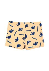 Costumi da bagno per ragazzi in pesca chiaro con stampa di dinosauri blu navy e testo "Jurassic World". Realizzati in materiale morbido e leggero. Vita elasticizzata.