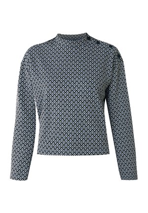 Lange mouwen top in zwart-wit geometrisch patroon, met een hoge hals en een getailleerd ontwerp. Zachte stof met een gladde textuur.