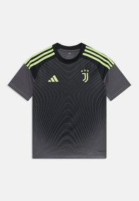 T-shirt de sport noire à manches courtes, avec des rayures vertes sur les épaules, un motif texturé et le logo de la Juventus sur la poitrine.
