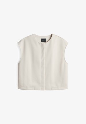 Top corto a maniche, di colore crema, realizzato in un tessuto liscio, con scollo rotondo, patta frontale e design pulito e minimalista con fessure laterali.