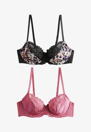 Reggiseno in pizzo floreale nero e satin con la parte superiore a fantasia, abbinato a un reggiseno rosa uniforme con dettagli in pizzo e spalline regolabili.