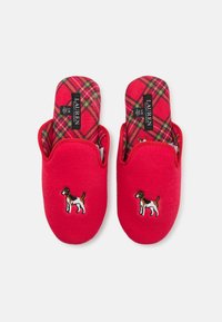 Red fabric slippers with a rounded toe, featuring a plaid interior and embroidered dog design on the upper. Soft texture throughout.