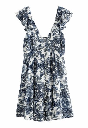 Robe blanche sans manches avec motif cachemire bleu, bretelles volantées et boutons sur le devant.