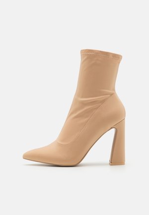 High heeled ankle boots - beige