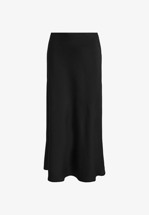 Svart kjol i slät tyg; har en tajt midja och en utsvängd nederkant, vilket ger en slank, rak silhuett utan synliga knäppningar.