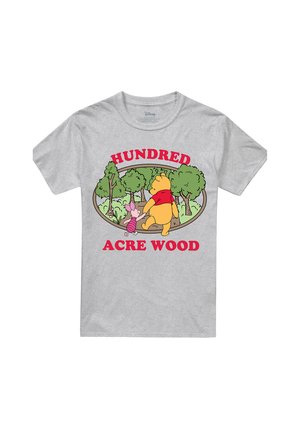 Characters Winnie the Pooh and Piglet walk hand-in-hand in a forest scene with "Hundred Acre Wood" text on a gray T-shirt.