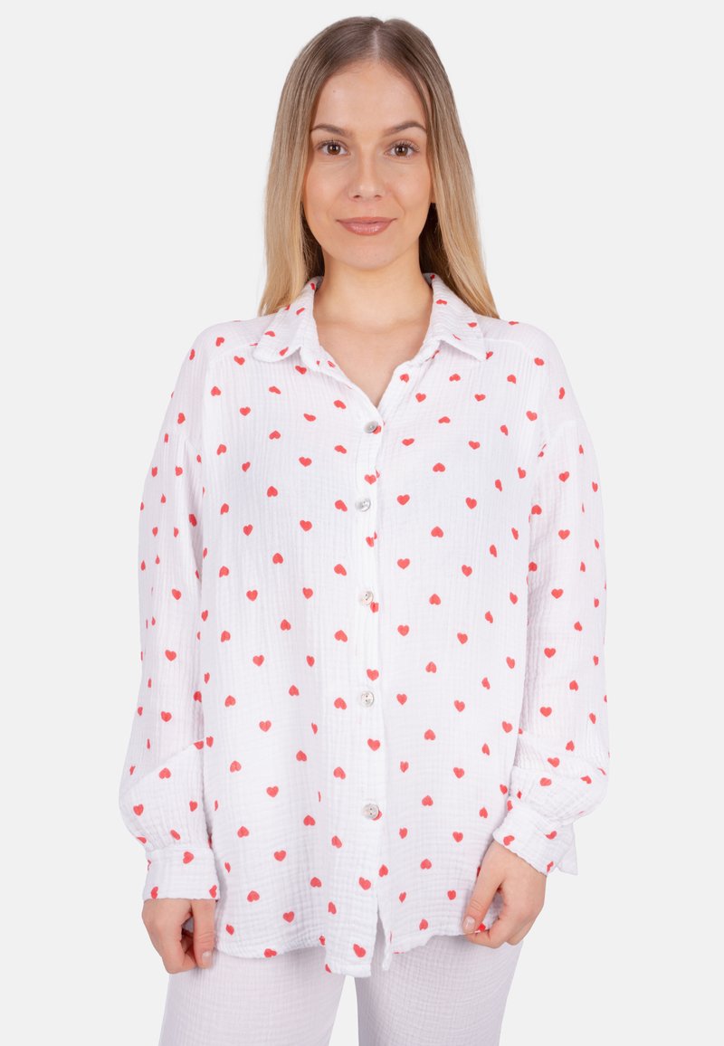 White button-up shirt with red heart patterns, long sleeves, and a textured fabric. Features a collar and front-button closure.