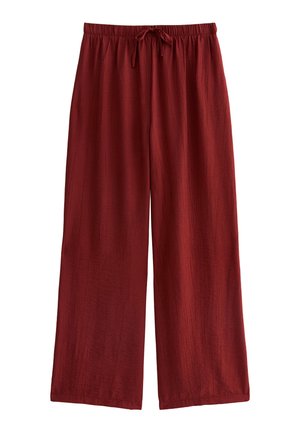 Pantaloni a gamba larga di colore rosso scuro, realizzati in un tessuto testurizzato. Presentano una vita elastica con coulisse per una regolazione ottimale.