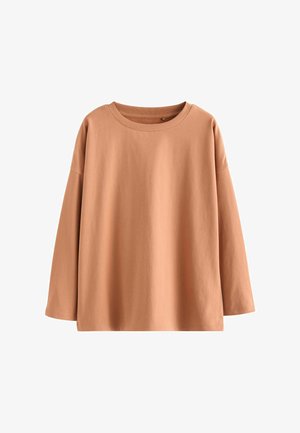 Langærmet, crew-neck top i dæmpet orangebrun bomuld. Har en afslappet pasform med sænkede skuldre og en glat stofstruktur.