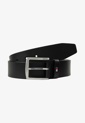 Black leather belt with a silver metal buckle and single prong. It features a logo accent in red, white, and blue near the buckle.