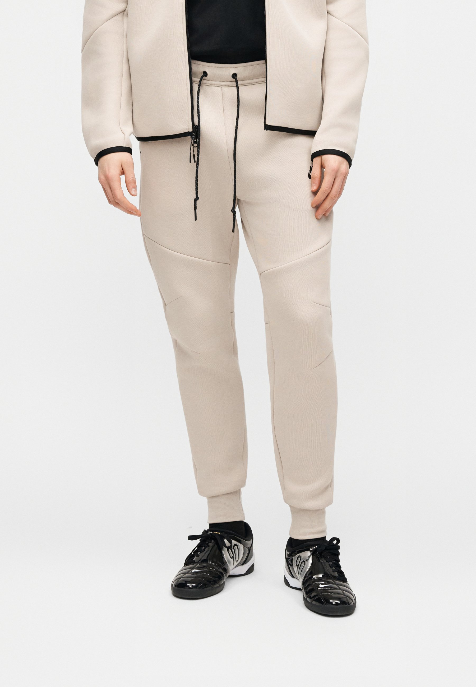 nike tech cream joggers