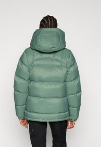 Fjällräven EXPEDITION DOWN LITE JACKET W - Gewatteerde jas - patina green/mustard yellow