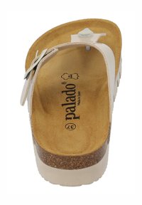 Hvide slip-on sandaler med korksål og brun fodseng. Har en enkelt strop med en knap og prægning af brandnavnet på fodsengen.