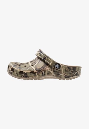 Croc-style clogs in camo pattern with cut-out ventilation holes, made of lightweight synthetic material, featuring a back strap for a secure fit.