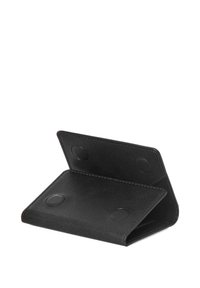 Black faux leather wallet with a fold-over design, featuring two circular magnetic closures and textured interior. No exterior patterns present.