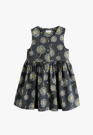Ærmeløs sort kjole til småbørn med knapper foran og print af hvide tusindfryd med gule midter og stilke.