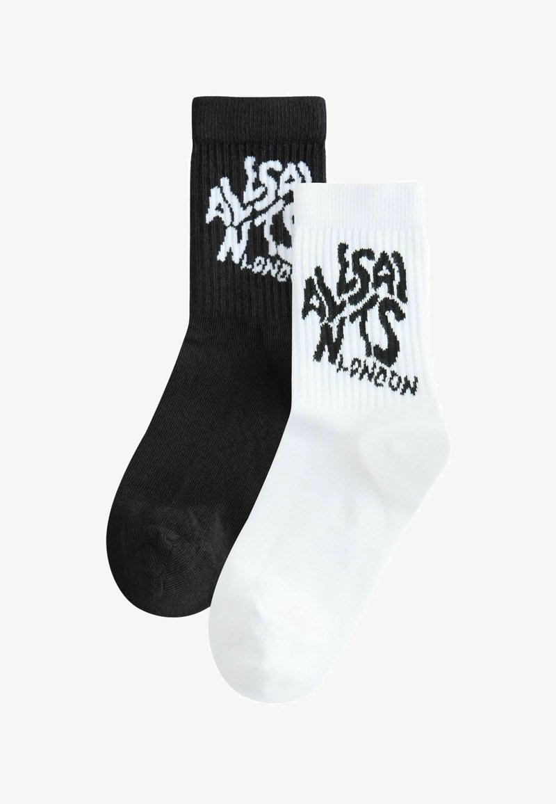 Chaussettes côtelées noir et blanc avec le texte « ALSAINTS LONDON » en couleurs contrastées. La chaussette noire porte un texte blanc, et inversement.