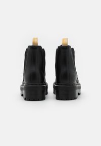 Dr. Martens Botines con plataforma - black