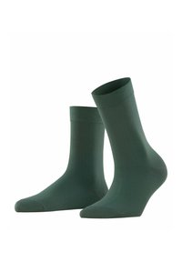 Grüne Knöchelsocken aus einem glatten, dehnbaren Material in einfarbiger Ausführung, mit einem gerippten Bündchen und einem verstärkten Zehenbereich.