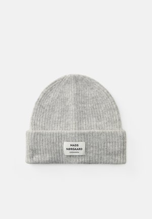 Gray knitted beanie hat with a ribbed texture and a folded cuff. Features a rectangular tag with black text on a white background.