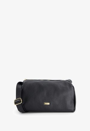 Black leather crossbody bag with a textured finish, gold hardware, and a zip closure. Features a flat shoulder strap and rounded shape.
