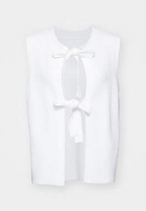 Bela brezrokavna obleka z teksturirano tkanino, okroglo izrezano ovratnikom in sprednjim zavezovanjem. Preprost, čist dizajn z odprtimi stranmi.